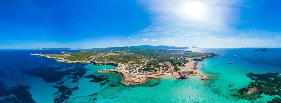 Jet Ski Adventure to the pristine Cala Conta - Passing the unusual shape of Es Vedrà