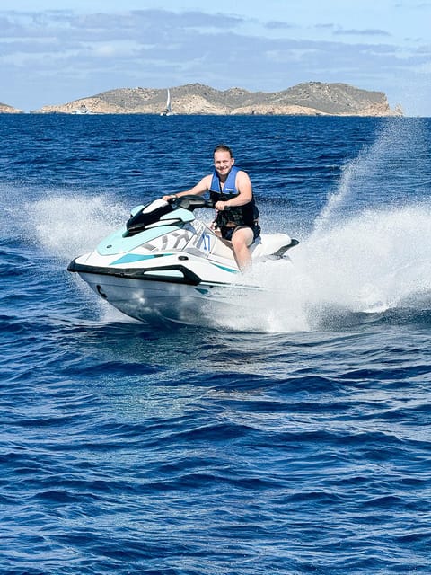 Jet Ski Trip to Cala Comte from San Antonio No license - Languages, service, and the uneven start