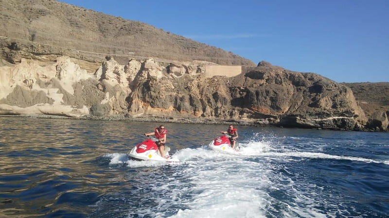 MASPALOMAS: JETSKI 30 MINUTES <em>FREE PICKUP & DROPOFF – Key points at a glance’ /></p>
<ul>
<li><strong>Thirty minutes at the controls:</strong> You ride your own Yamaha VX jetski around a buoy-marked circuit rather than sitting behind a driver.</li>
<li><strong>Maspalomas views:</strong> The route gives you changing views of the golden dunes, Atlantic coast, and famous lighthouse.</li>
<li><strong>Solo or shared ride:</strong> You can use a jetski alone or share one with another person, subject to the booking arrangement.</li>
<li><strong>Small operating group:</strong> The activity is limited to four participants, which helps keep the briefing and launch process manageable.</li>
<li><strong>Hotel transfer included:</strong> Pickup and drop-off are offered outside Playa del Ingles, but service can be late or difficult to identify.</li>
<li><strong>Adults at the controls:</strong> You must be at least 18 to drive, or 16 with written parental authorization.</li>
</ul>
<h2>What the 30-minute Maspalomas circuit is really like</h2>
<p><img width="800" height="450" decoding="async" src=