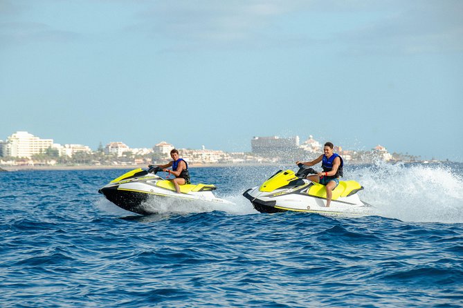 Tenerife Water Sports Package with 40 Min. Jet Ski and Parascending for 2 People - Taking the boat out to the jet skis